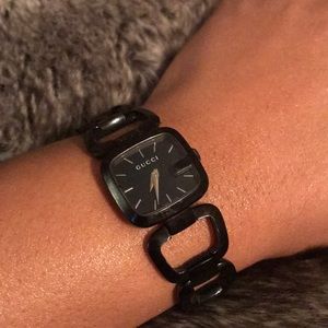 G-shaped black stainless steel Gucci timepiece